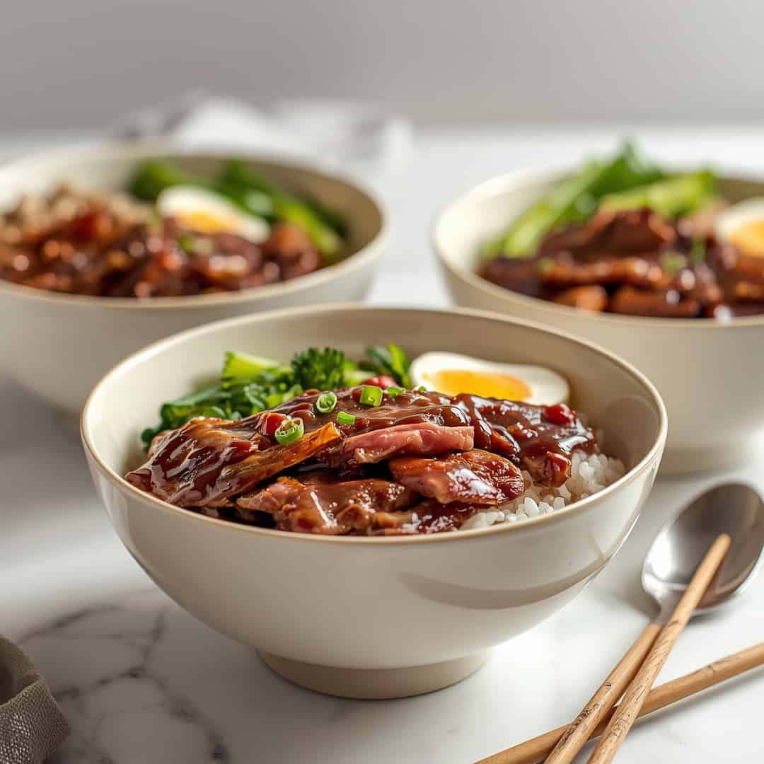 Korean BBQ Steak Rice Bowls - delicate fresh leaves tossed with vibrant seasonal toppings with fresh cracked pepper and lemon wedges