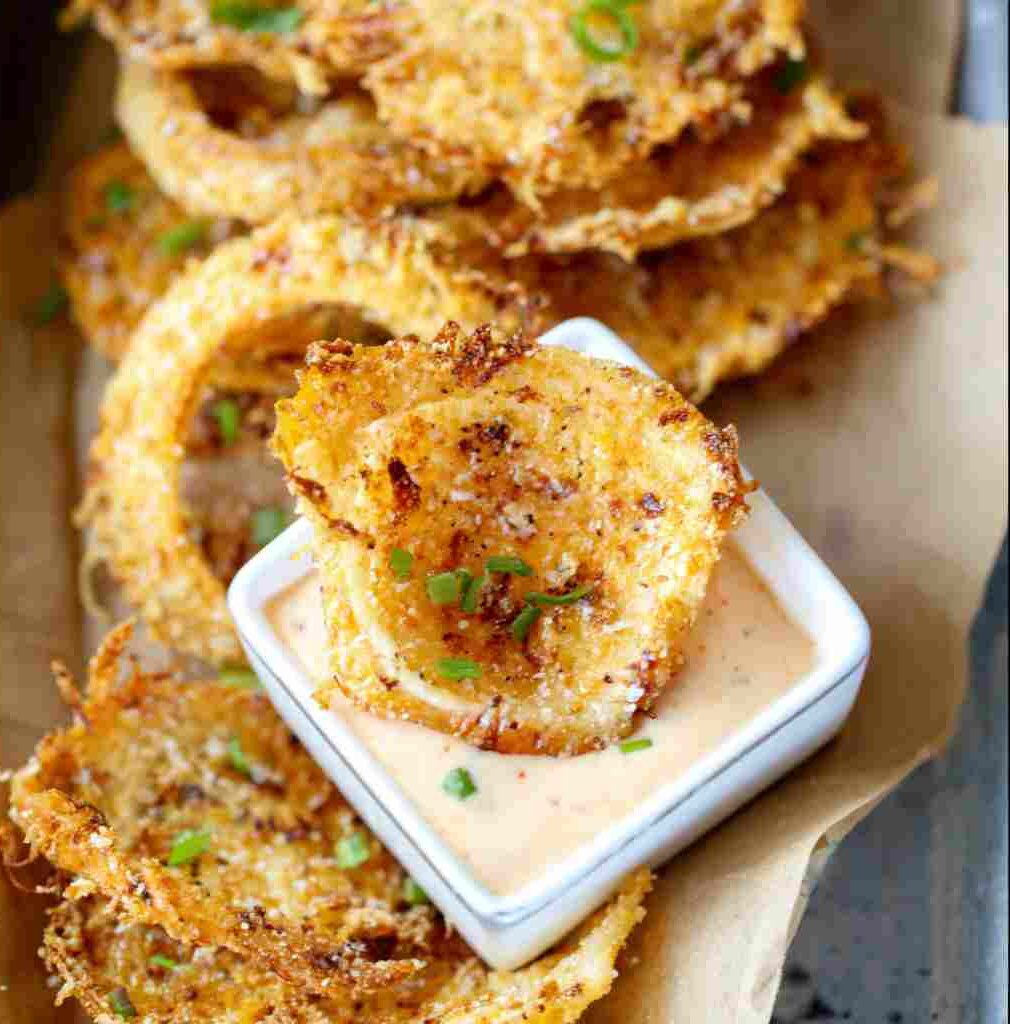Parmesan Onion Ring Chips - smooth creamy dipping consistency with baked bubbly top with chopped parsley and grated cheese
